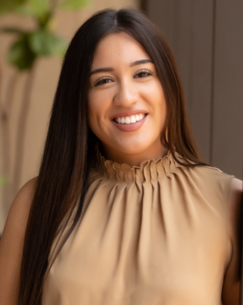 Portrait of Fryda Marquez, Lease Administration and Accounts Receivable Specialist at NAI FMA Realty, standing in an office setting.