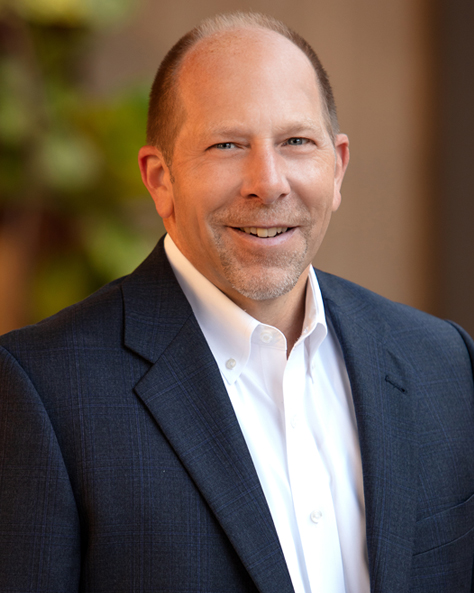 Portrait of Scott Vyskocil, Senior Vice President of Property Management at NAI FMA Realty, in an office setting.